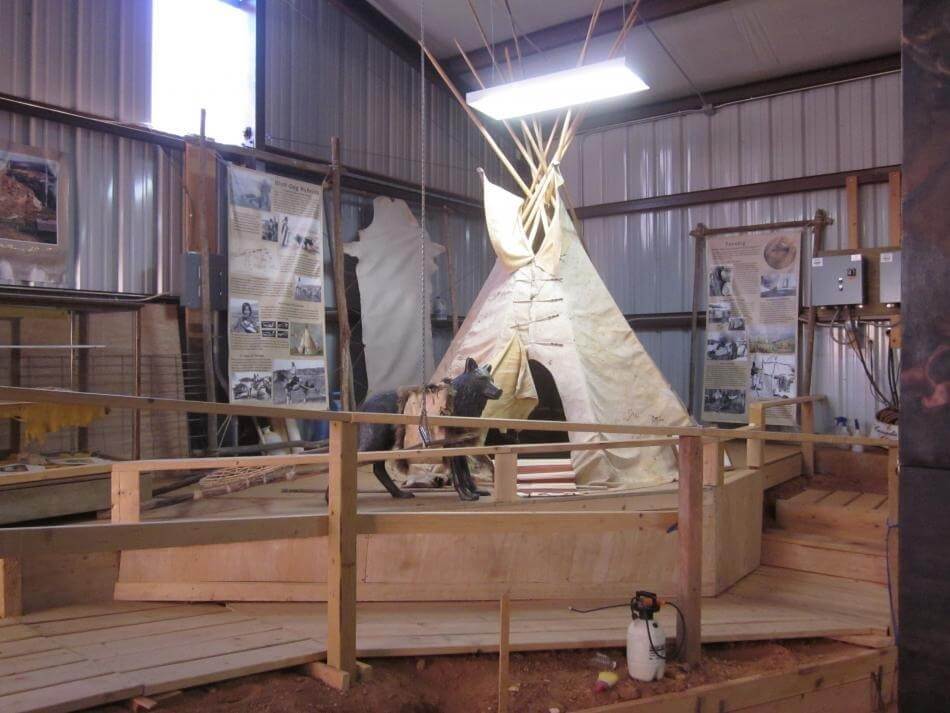 The new tipi found a home in the big building down in the sinkhole. Note tipis pulled by dog travois were smaller than later when they had horses to haul their belongings. This tipi weighed about 90 pounds so would probably be pulled by two dogs.